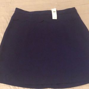 Purple polyester mini skirt.